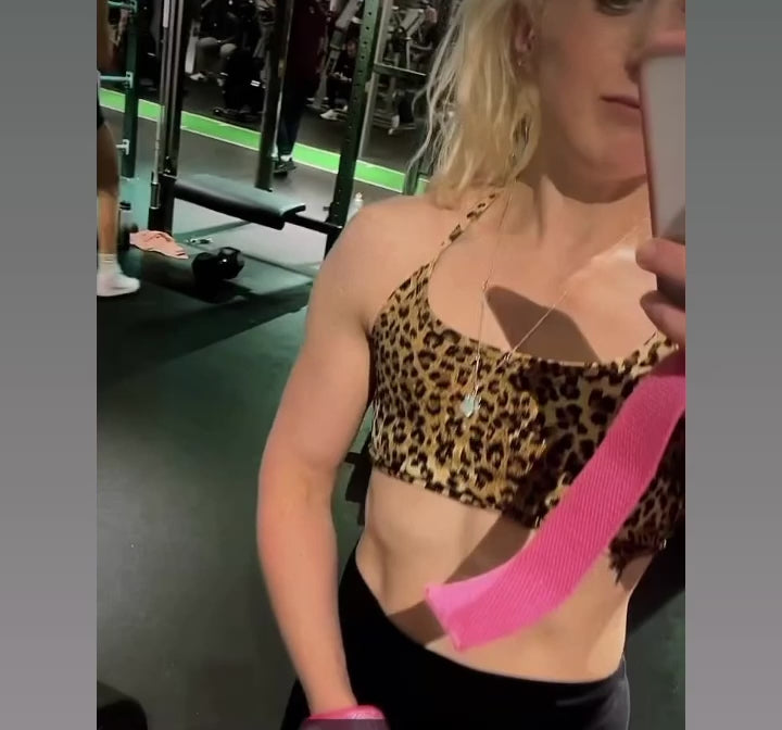 Bling Gym Pink Glitter Weight Lifting Straps with silicone grips being used by body builder.